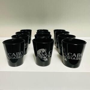 A Set of 12 Color Changing Cabo Diablo Tequila Shot Glasses